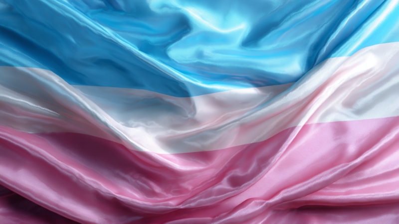 The transgender flag made of smooth satin fabric with light blue, pink, and white stripes
